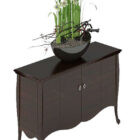 Gabinete lateral negro con jarrón para plantas