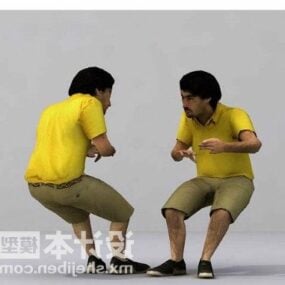 黄色のシャツの男が座っている3Dモデル