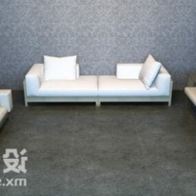 Sofá blanco con almohada sobre suelo de hormigón modelo 3d