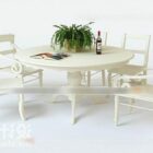 Pyöreä ruokapöytä ja tuoli valkoiseksi maalattu