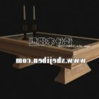 Mesa de centro de madera con tapa de cristal y vela