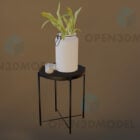 Kleiner Hockertisch mit Topfpflanze